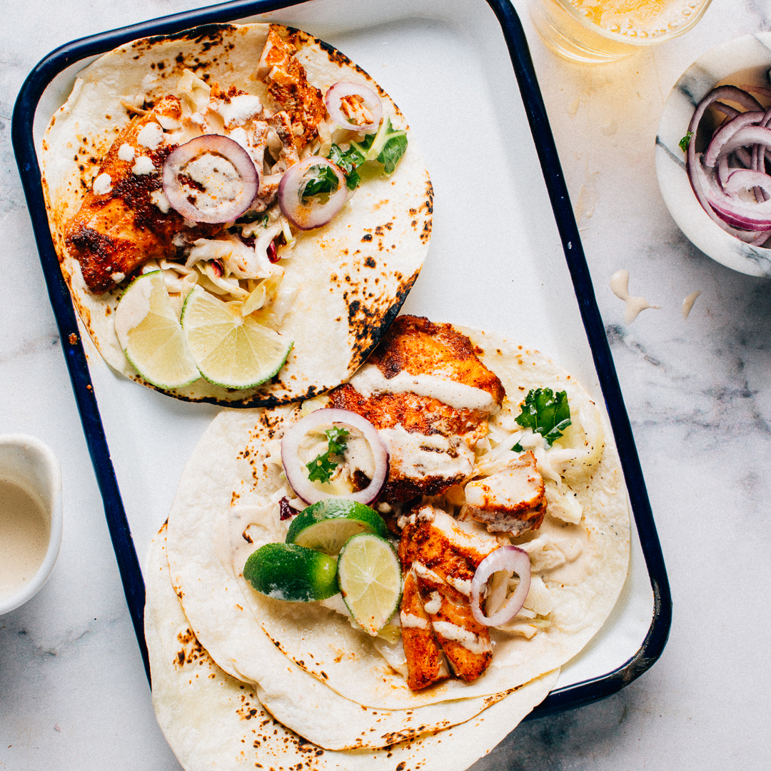 Grilled Spicy Fish Tacos with Cabbage Slaw and Lime Crema